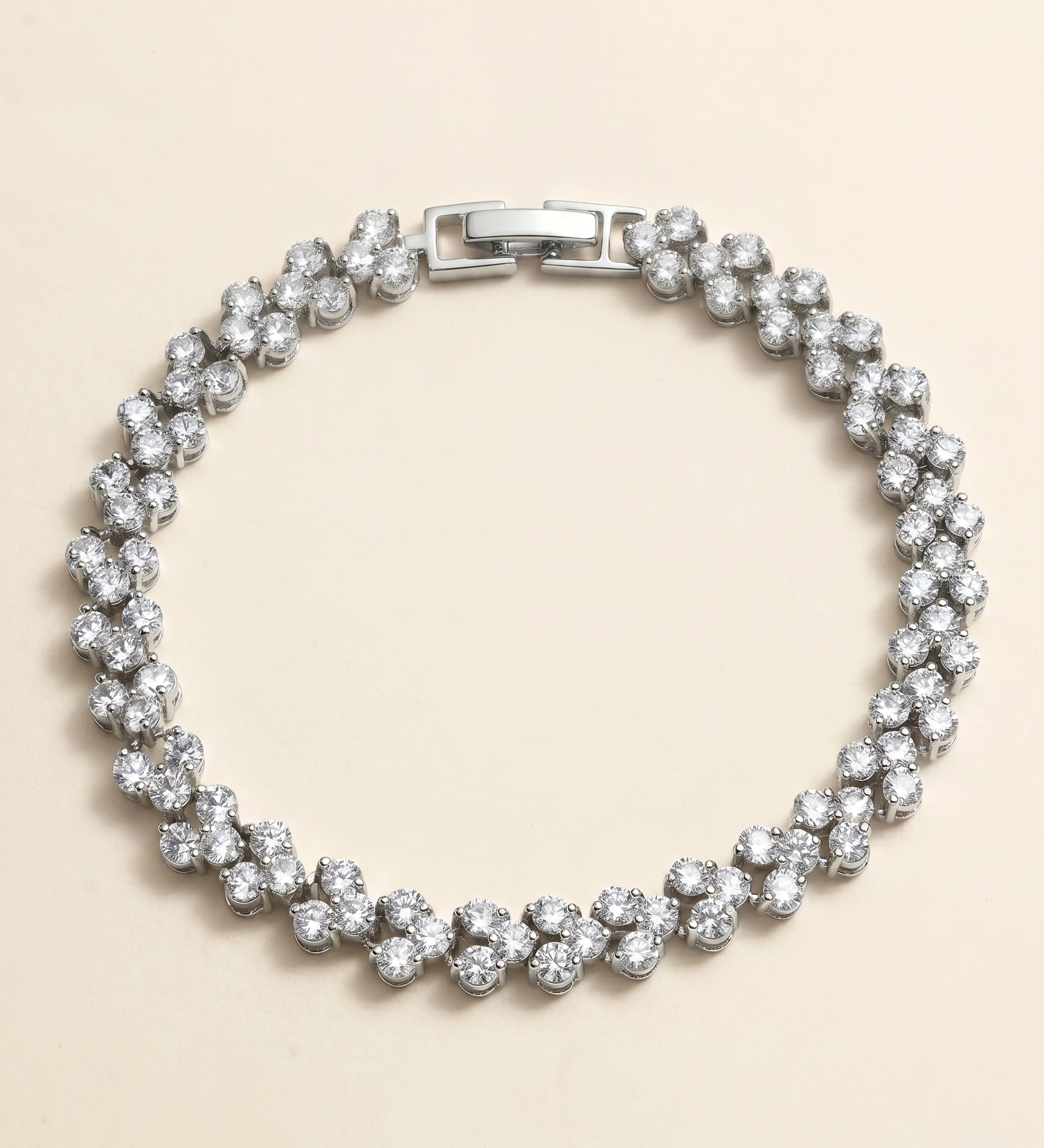 A silver bracelet adorned with numerous sparkling diamonds arranged in a circular pattern.