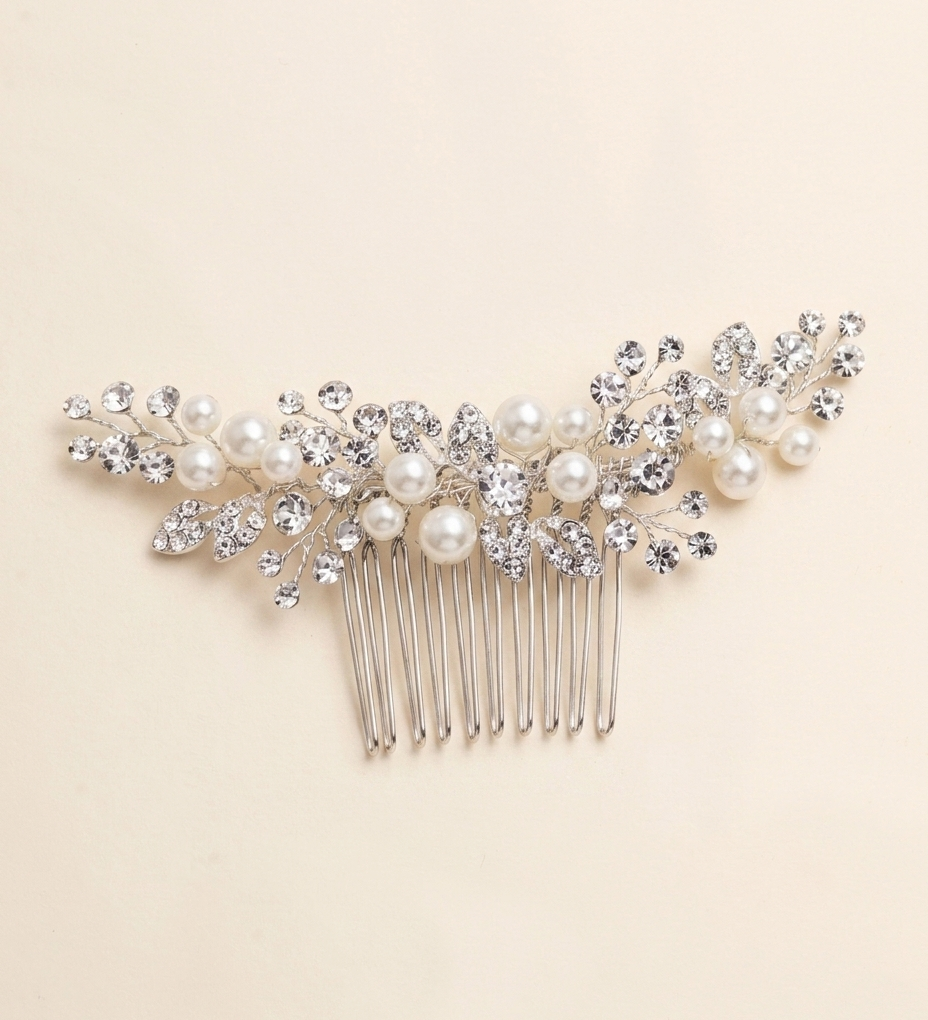 A decorative hair accessory with a comb and pearls.