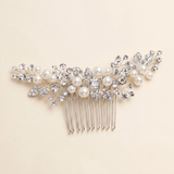 A decorative hair accessory with a comb and pearls.