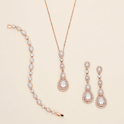 a necklace, bracelet, and earrings on a white surface