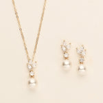 a necklace and earring set with pearls