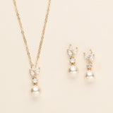 a necklace and earring set with pearls
