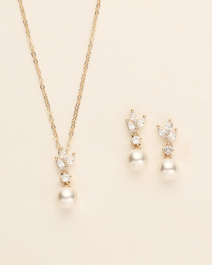 a necklace and earring set with pearls