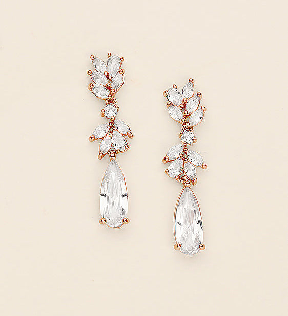 A pair of elegant earrings with clear gemstones and a delicate floral design.
