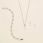a necklace and earring set with pearls