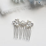 a close up of a hair comb with pearls