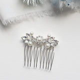a close up of a hair comb with pearls