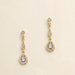 A pair of gold earrings with diamond-encrusted dangling designs.