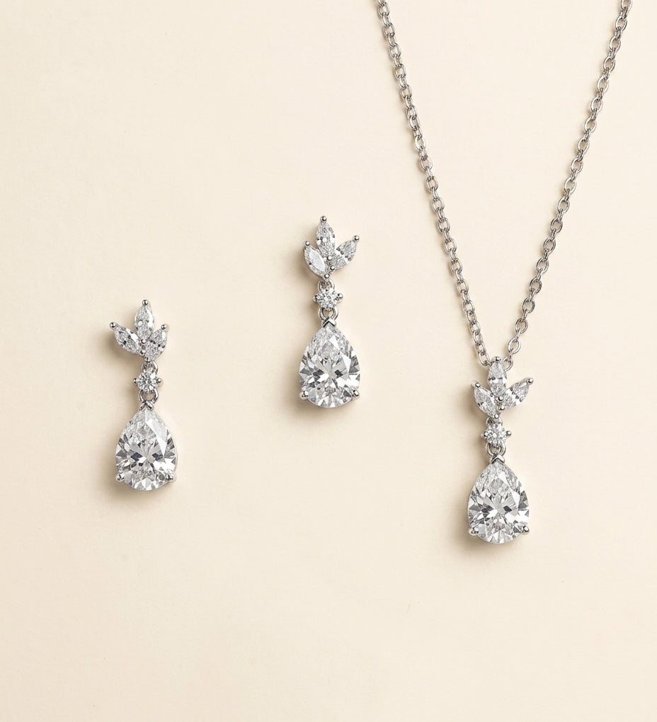 A necklace and earrings set made of sparkling diamonds.