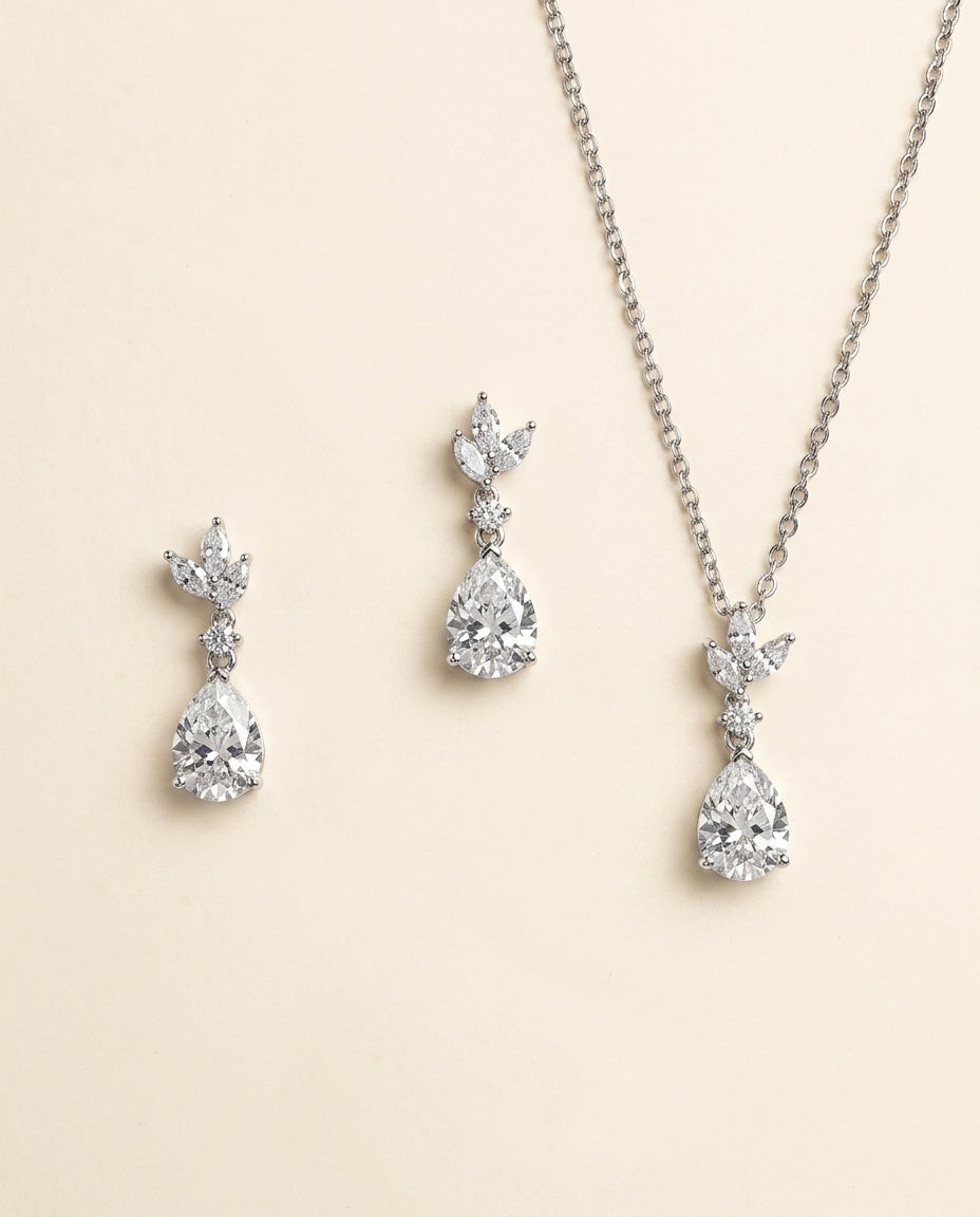 A necklace and earrings set made of sparkling diamonds.