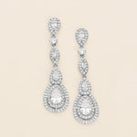 a pair of diamond earrings on a white background