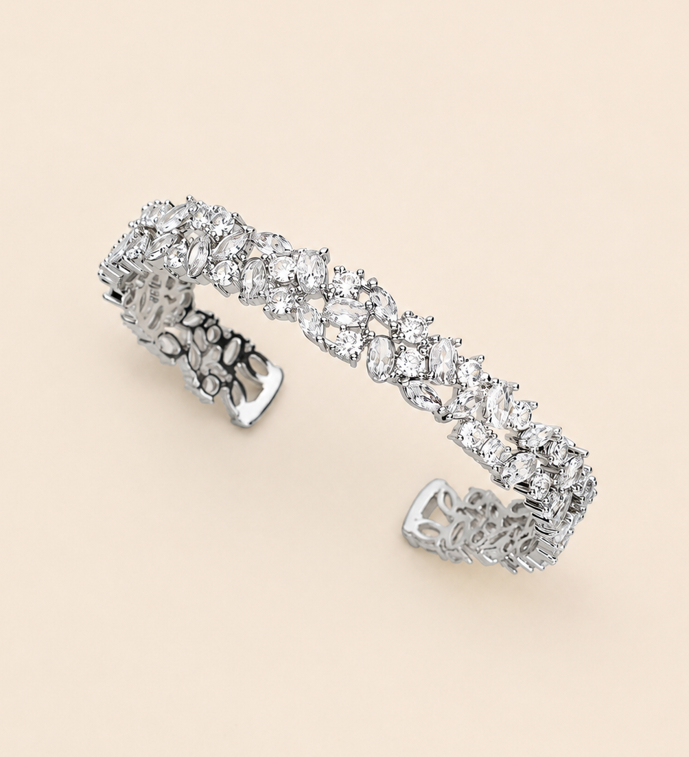 A silver bracelet adorned with numerous sparkling diamonds.
