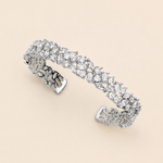 A silver bracelet adorned with numerous sparkling diamonds.