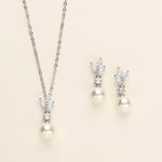 a necklace and earring set with pearls