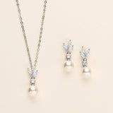 a necklace and earring set with pearls