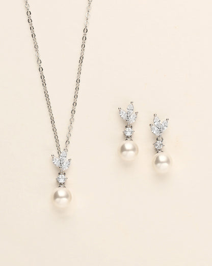 a necklace and earring set with pearls