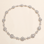 A necklace with numerous small, sparkling crystal pendants arranged in a circular pattern.
