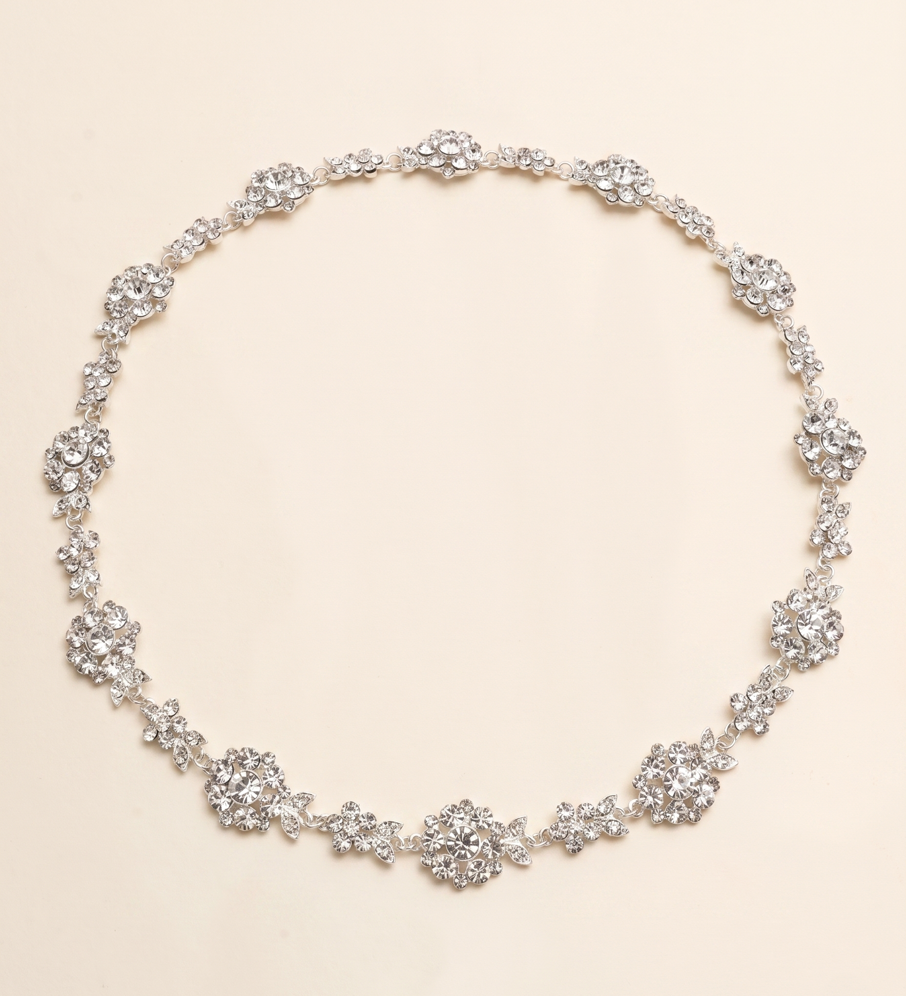A necklace with numerous small, sparkling crystal pendants arranged in a circular pattern.