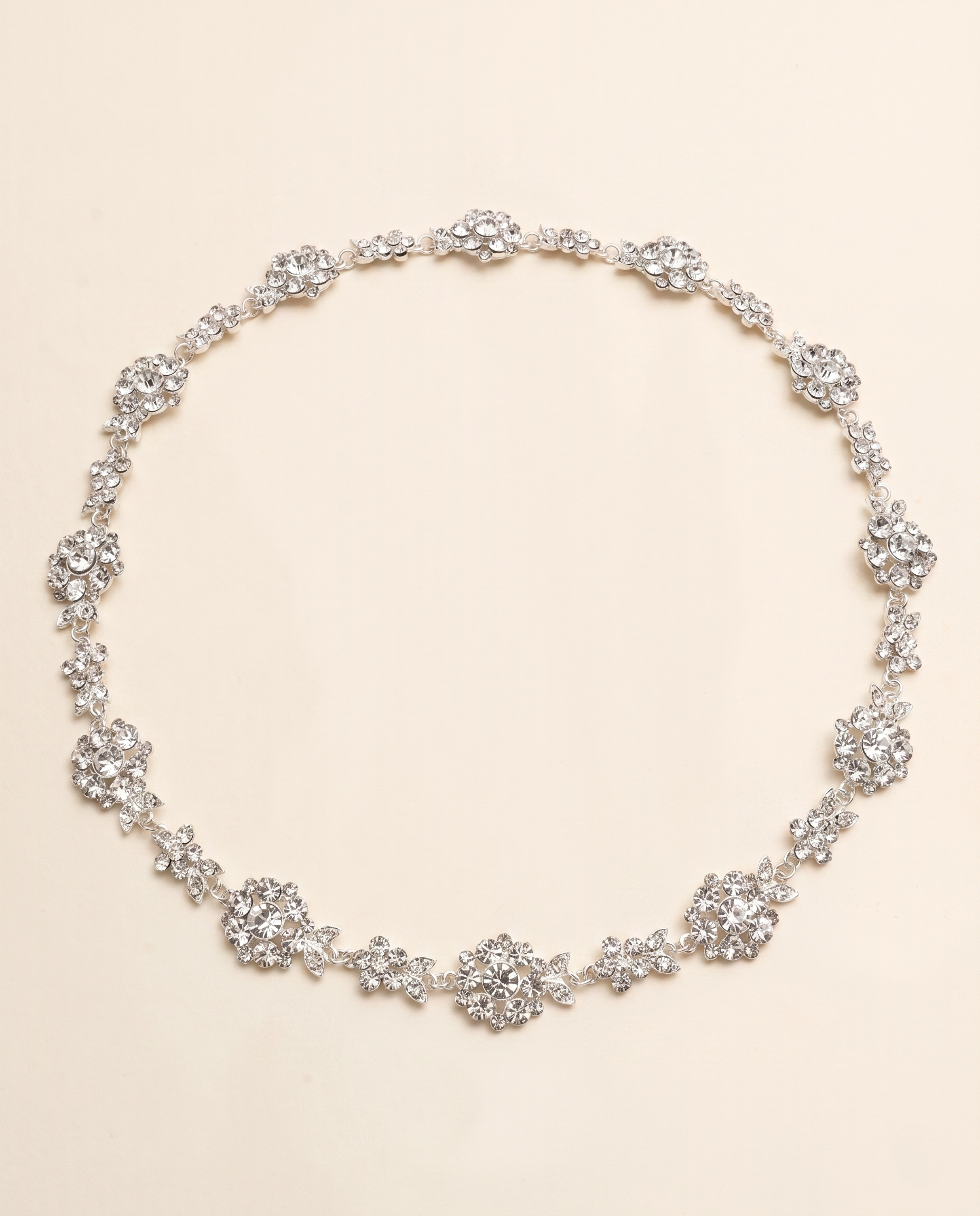 A necklace with numerous small, sparkling crystal pendants arranged in a circular pattern.