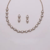 A necklace and earrings set made of sparkling rhinestones and pearls.
