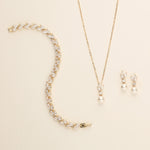 a necklace and earring set with pearls