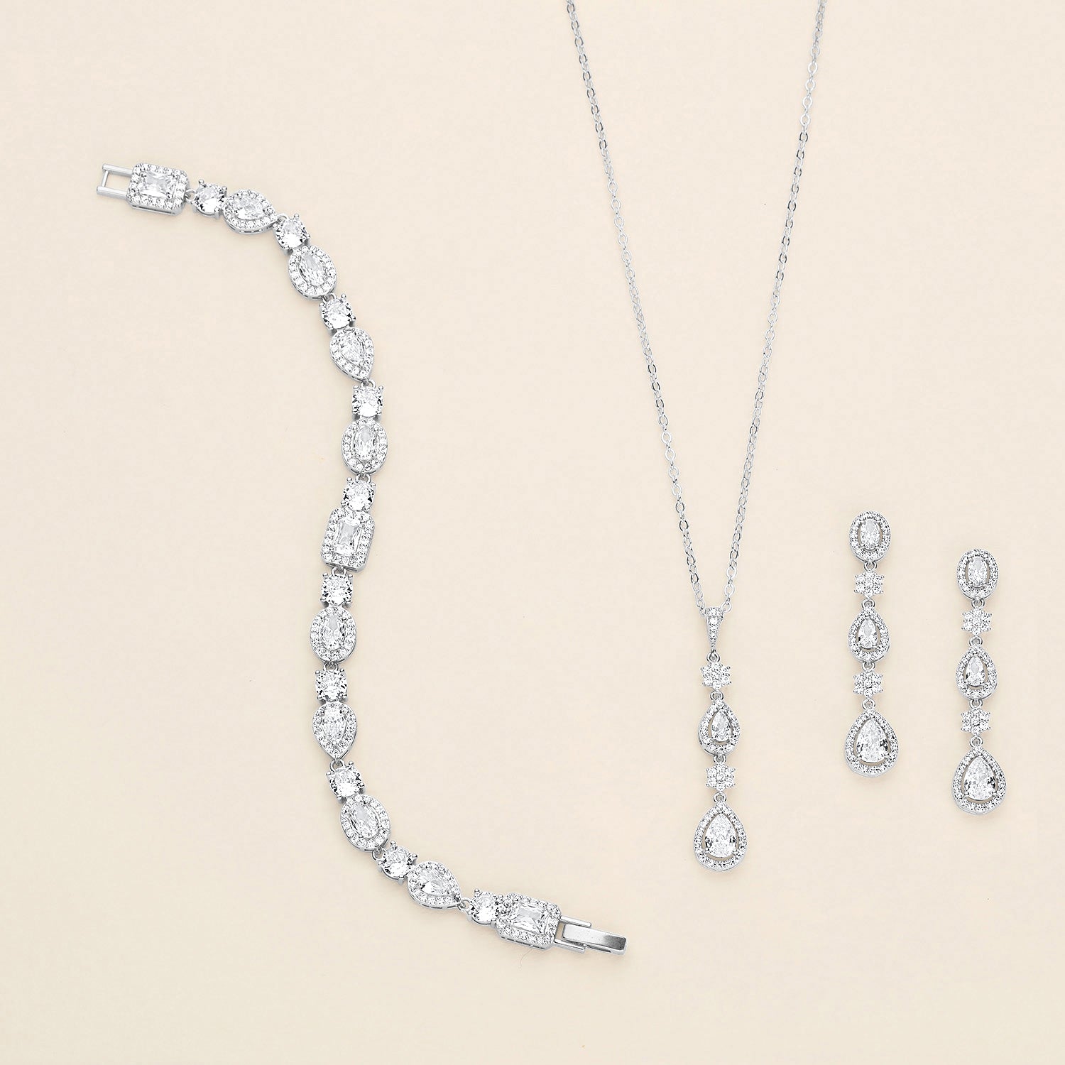 a necklace, bracelet, and earrings are on display