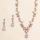 a necklace and earrings set with a delicate and elegant design.