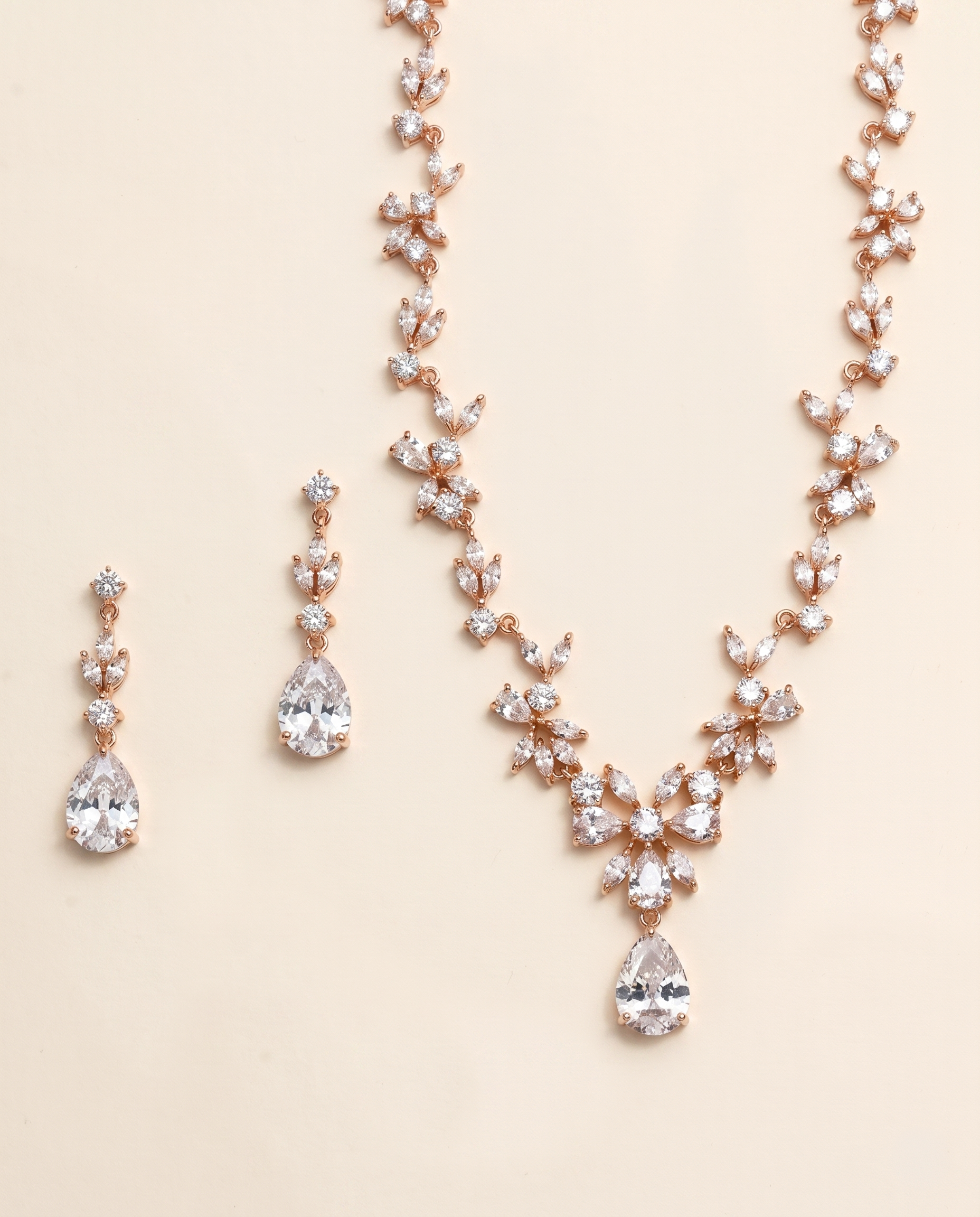 a necklace and earrings set with a delicate and elegant design.