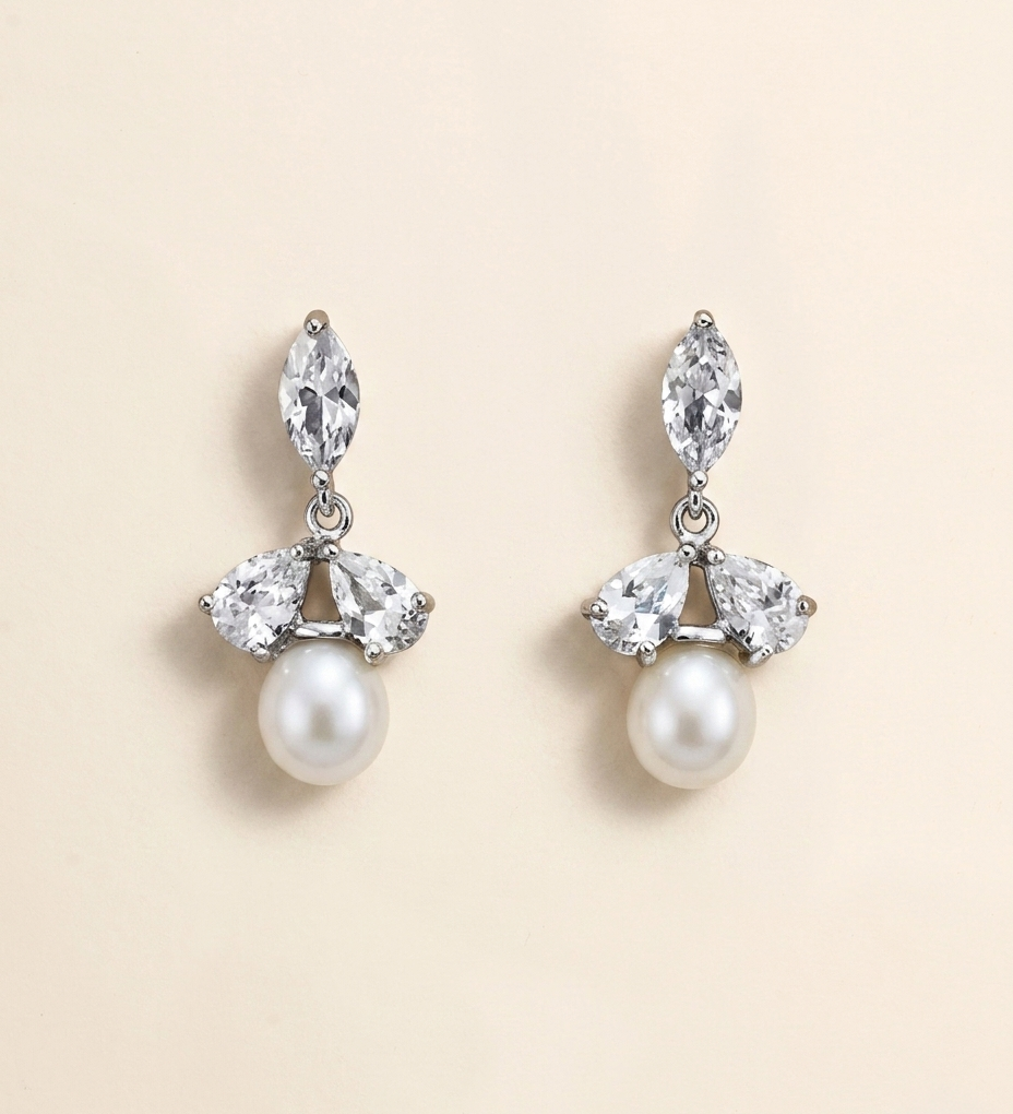 A pair of elegant earrings with a combination of pearls and diamonds.