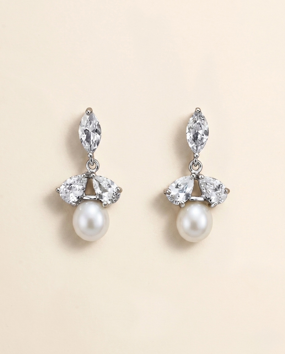 A pair of elegant earrings with a combination of pearls and diamonds.
