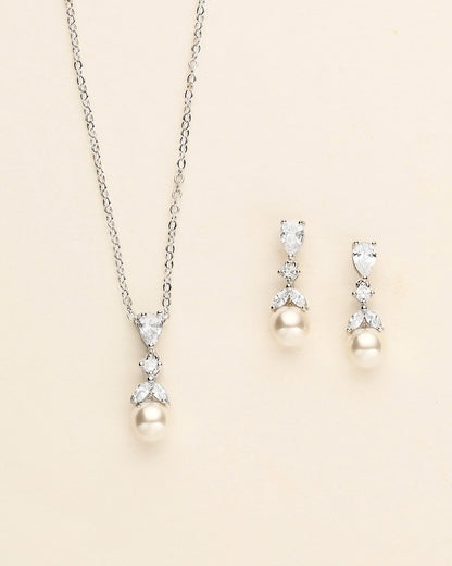 a necklace and earring set with pearls