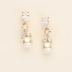 a pair of pearl and crystal earrings
