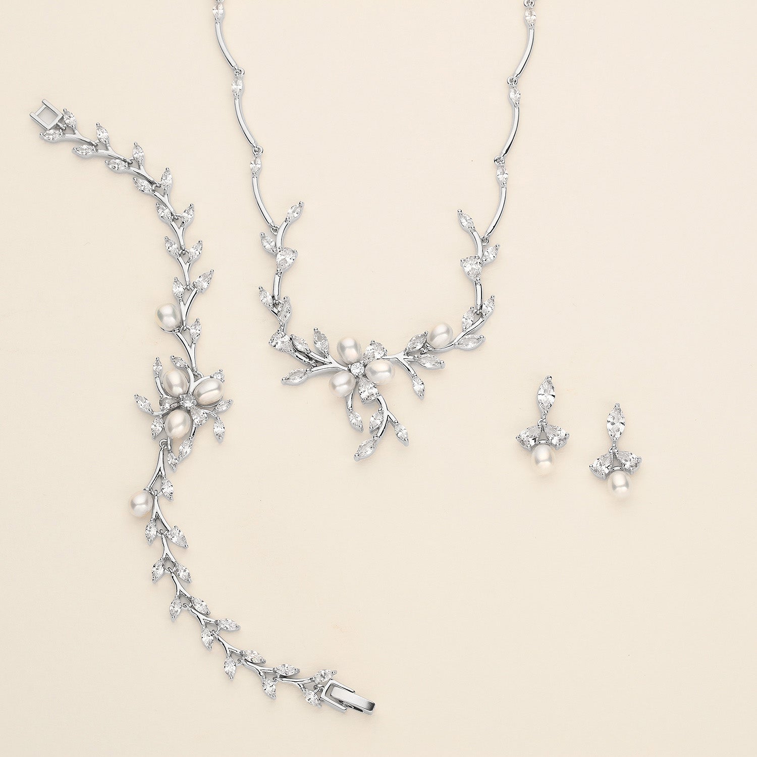 a necklace and earring set with pearls