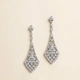 A pair of elegant diamond earrings with intricate designs and sparkling crystal elements.