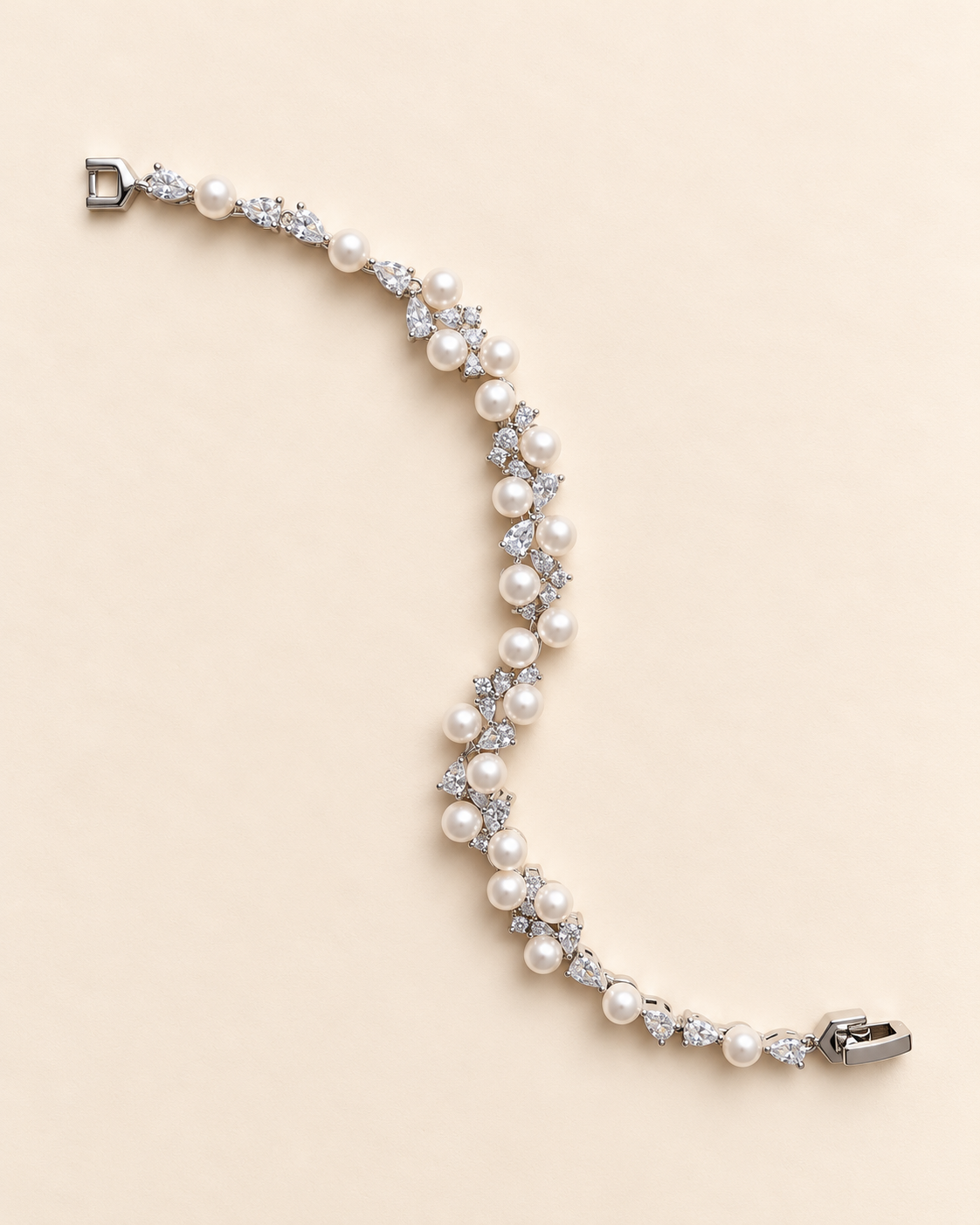 Athena silver-finish bracelet with round pearl-like accents and clear faceted details, shown full length on a cream background