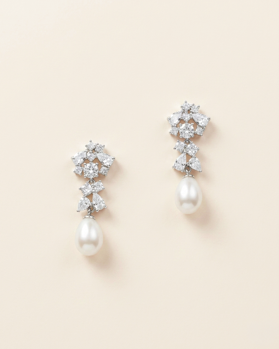 A pair of elegant earrings with a combination of pearls and diamonds.