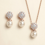 A necklace and earrings set with a delicate floral design and sparkling gemstones.