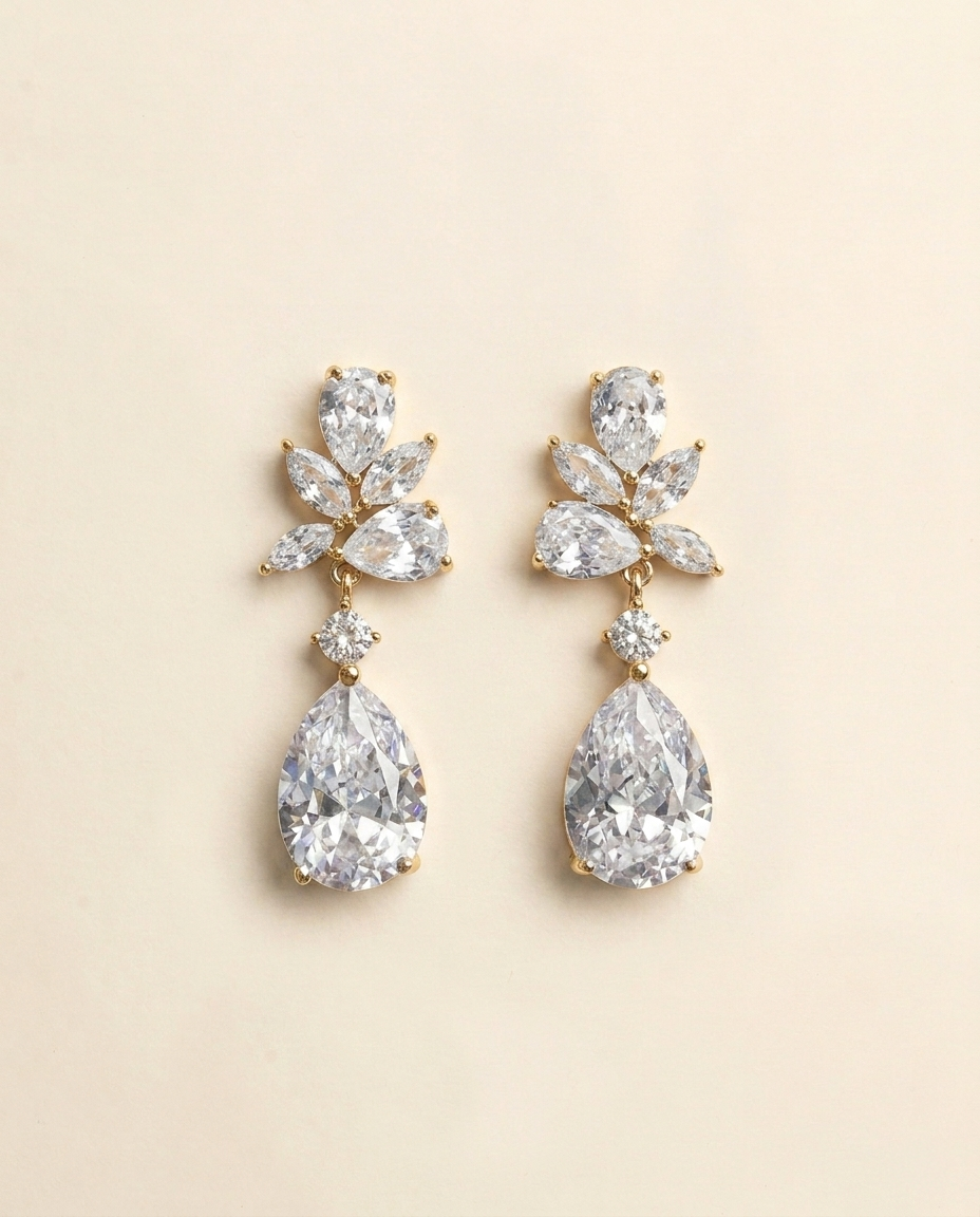 A pair of elegant diamond earrings with large, clear gemstones set in a gold-colored metal.