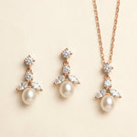 A necklace and earrings set with a delicate and elegant design.