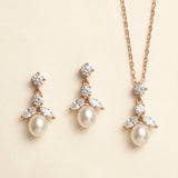 A necklace and earrings set with a delicate and elegant design.