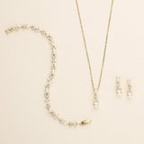 a necklace and earring set with pearls