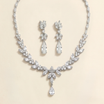 a necklace and earrings set made of sparkling diamonds.