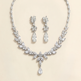 a necklace and earrings set made of sparkling diamonds.