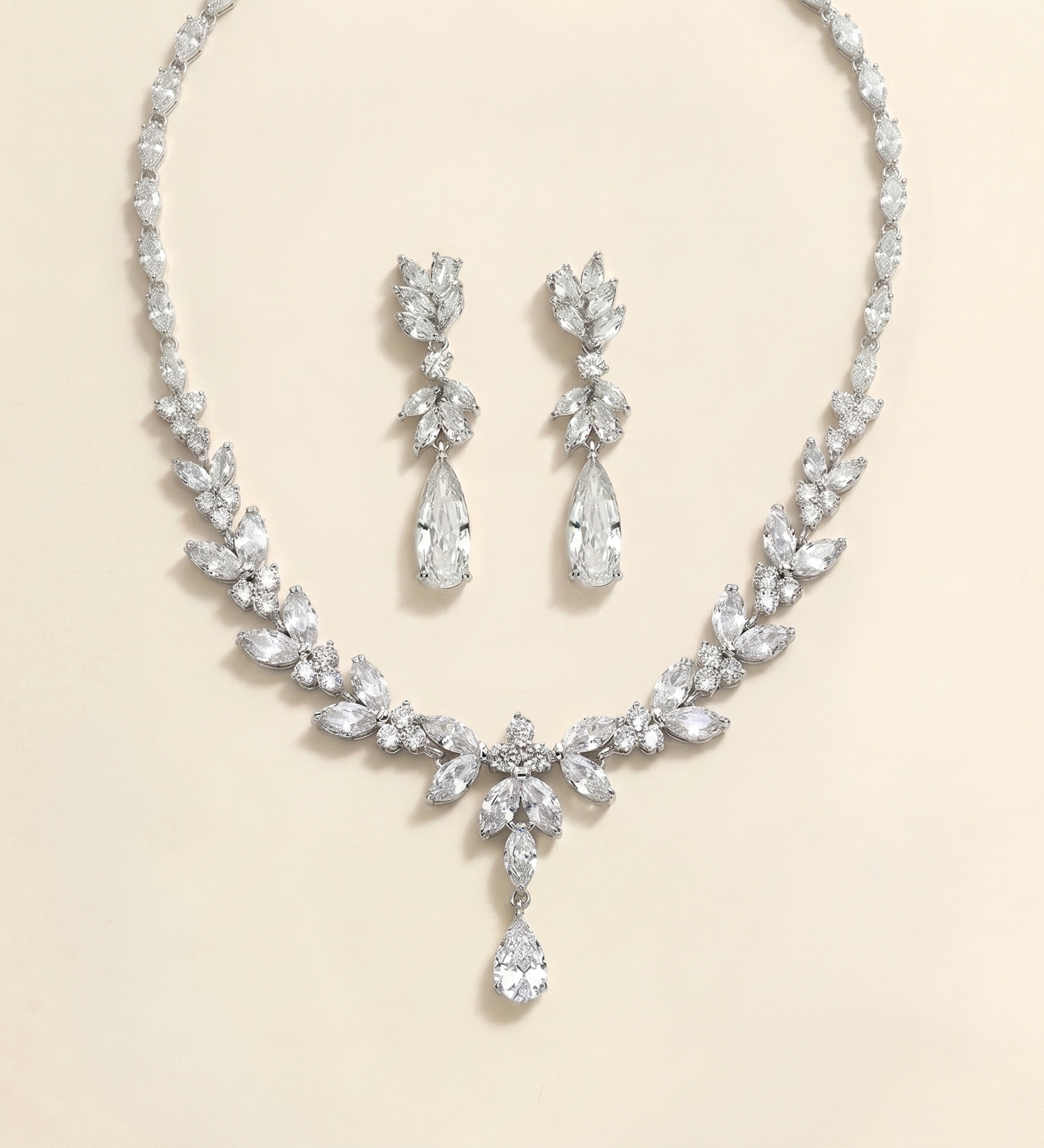 a necklace and earrings set made of sparkling diamonds.