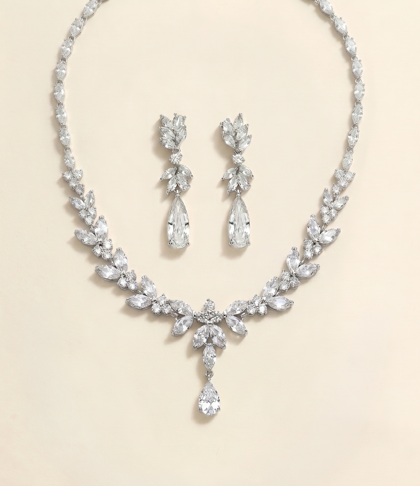 a necklace and earrings set made of sparkling diamonds.