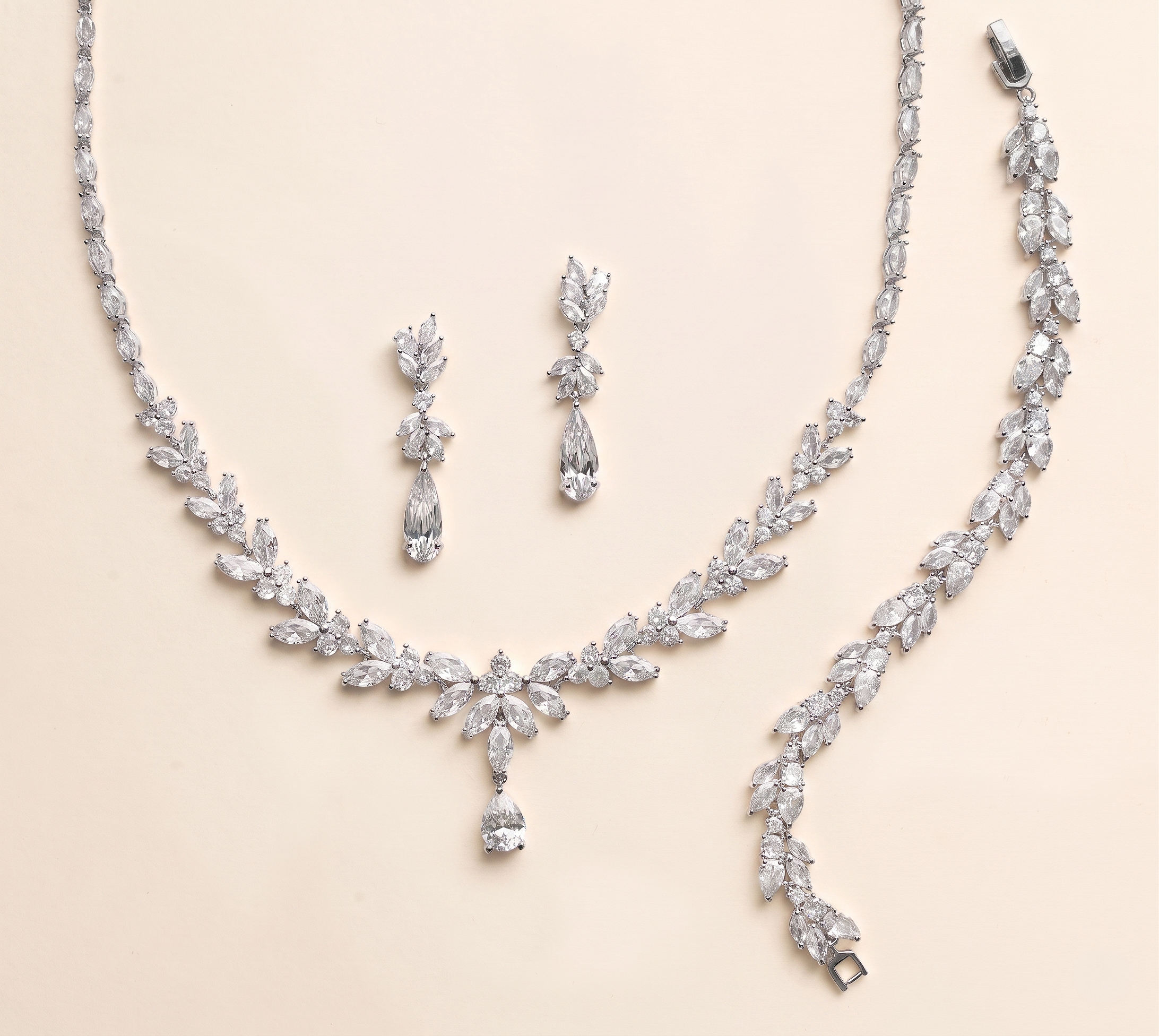 a necklace and earrings set made of sparkling diamonds.