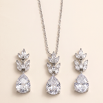 A necklace with a pendant and earrings made of large, clear gemstones.