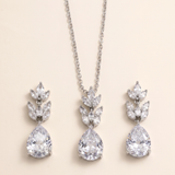 A necklace with a pendant and earrings made of large, clear gemstones.