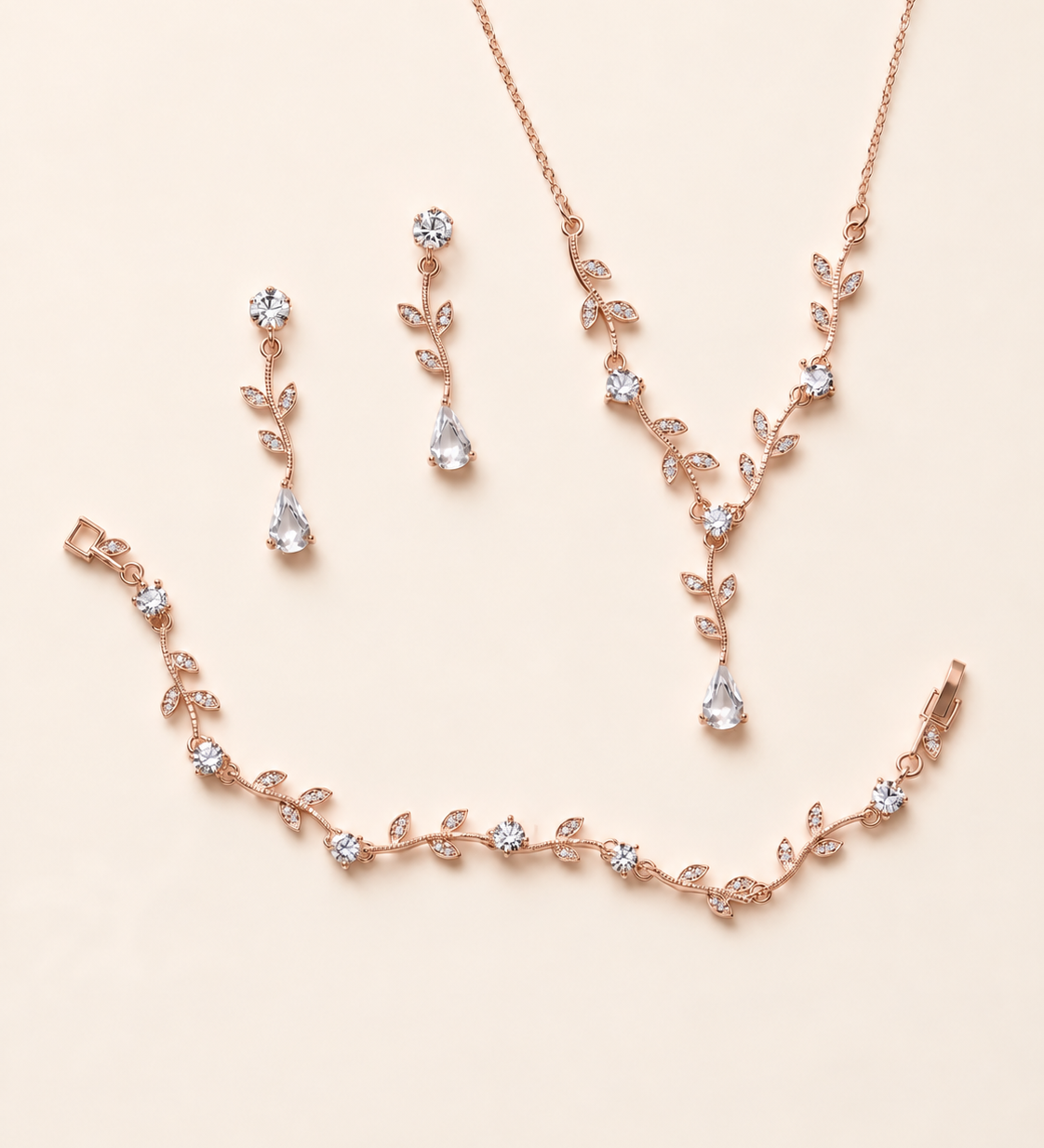 Carla rose gold earrings necklace and bracelet three-piece set on cream background