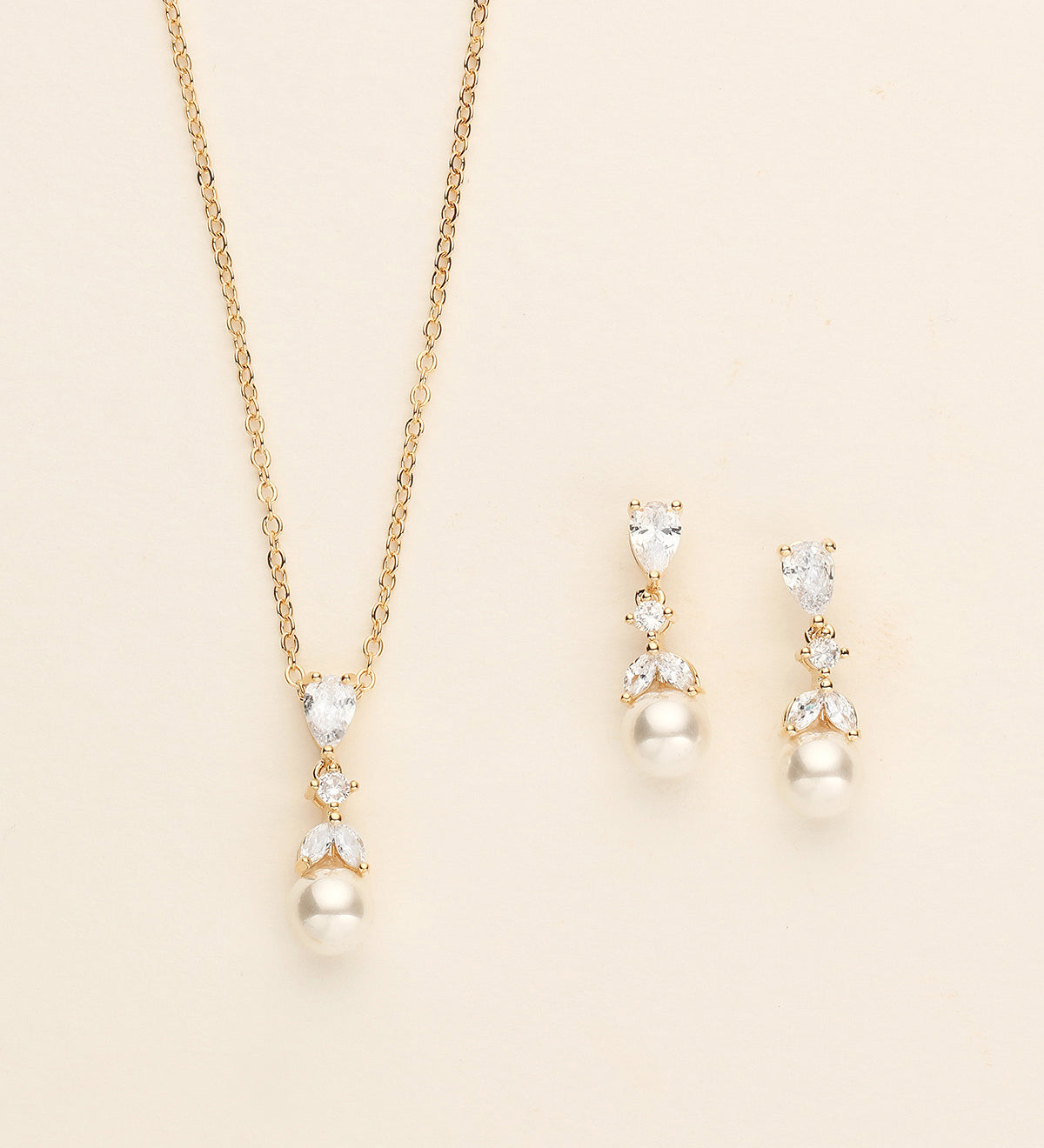 a necklace and earring set with pearls